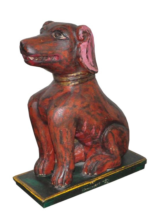 Image of Dog sculpture carved in wood