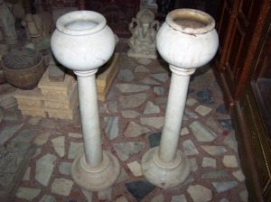 Image of Antique marble urns on pillar stands a pair
